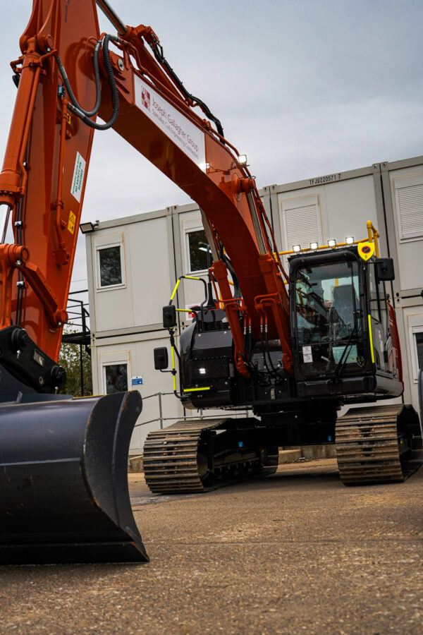 Hitachi excavator with AI Safety Shield and digital thumbs-up display, part of JGL’s £1m investment.